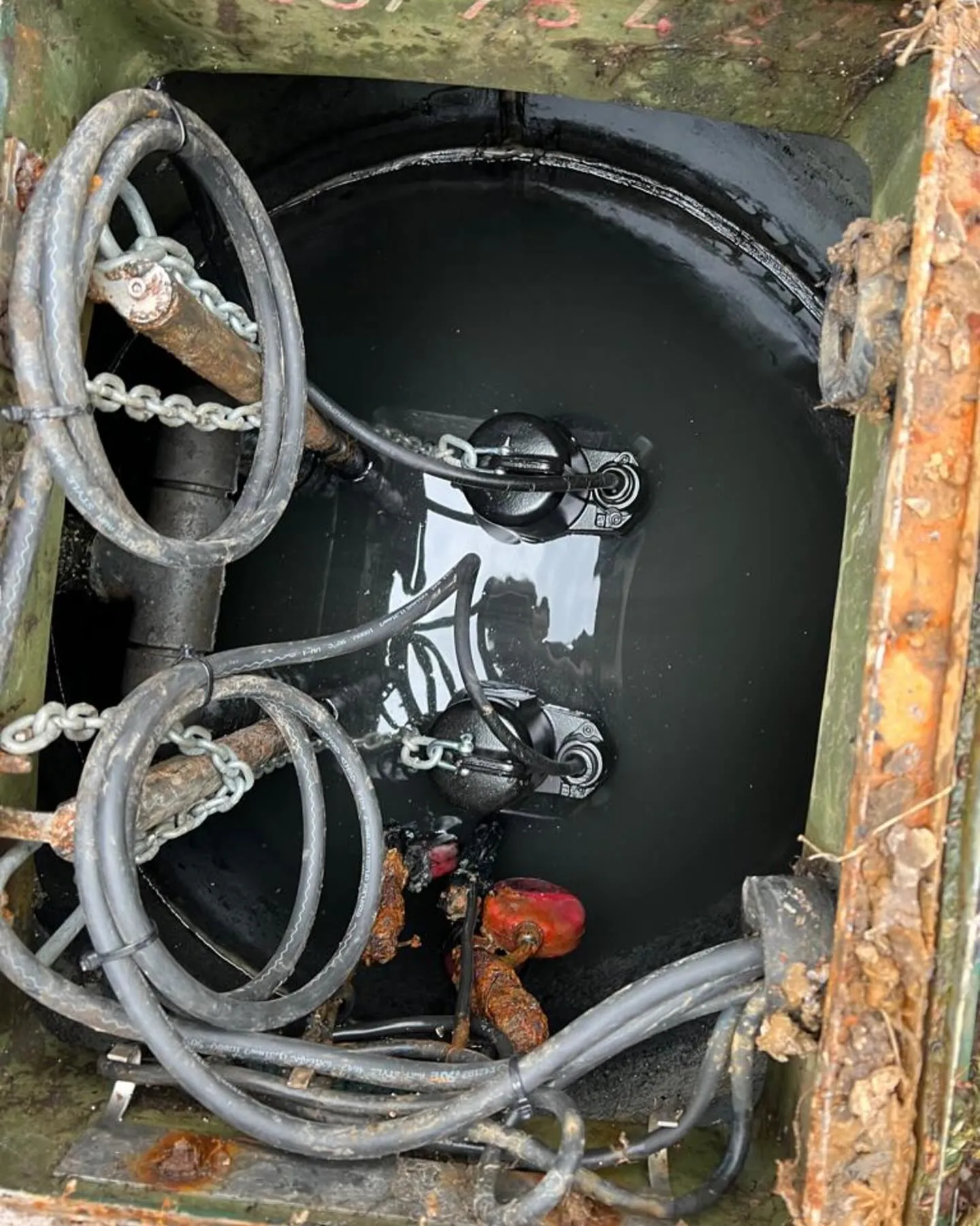 A close up of a metal box with a bunch of wires in it.