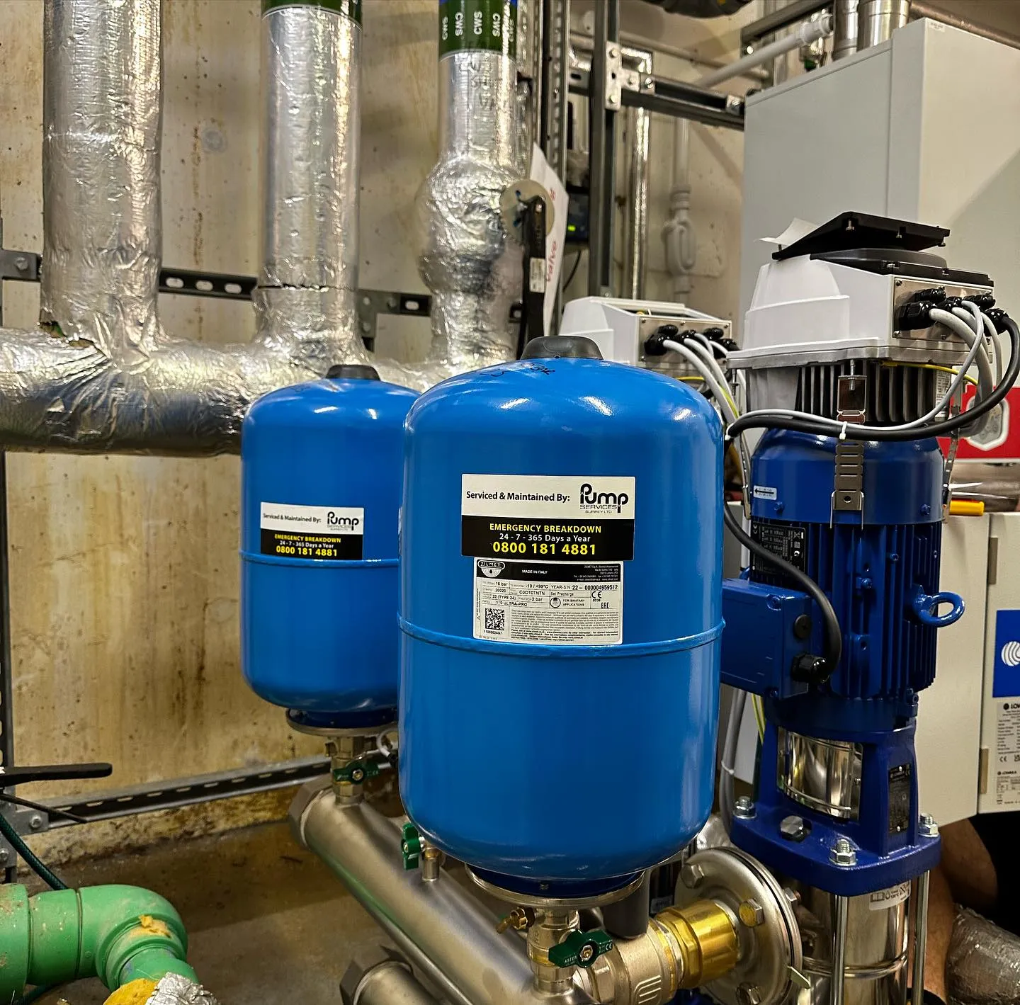 A couple of blue tanks sitting next to each other.